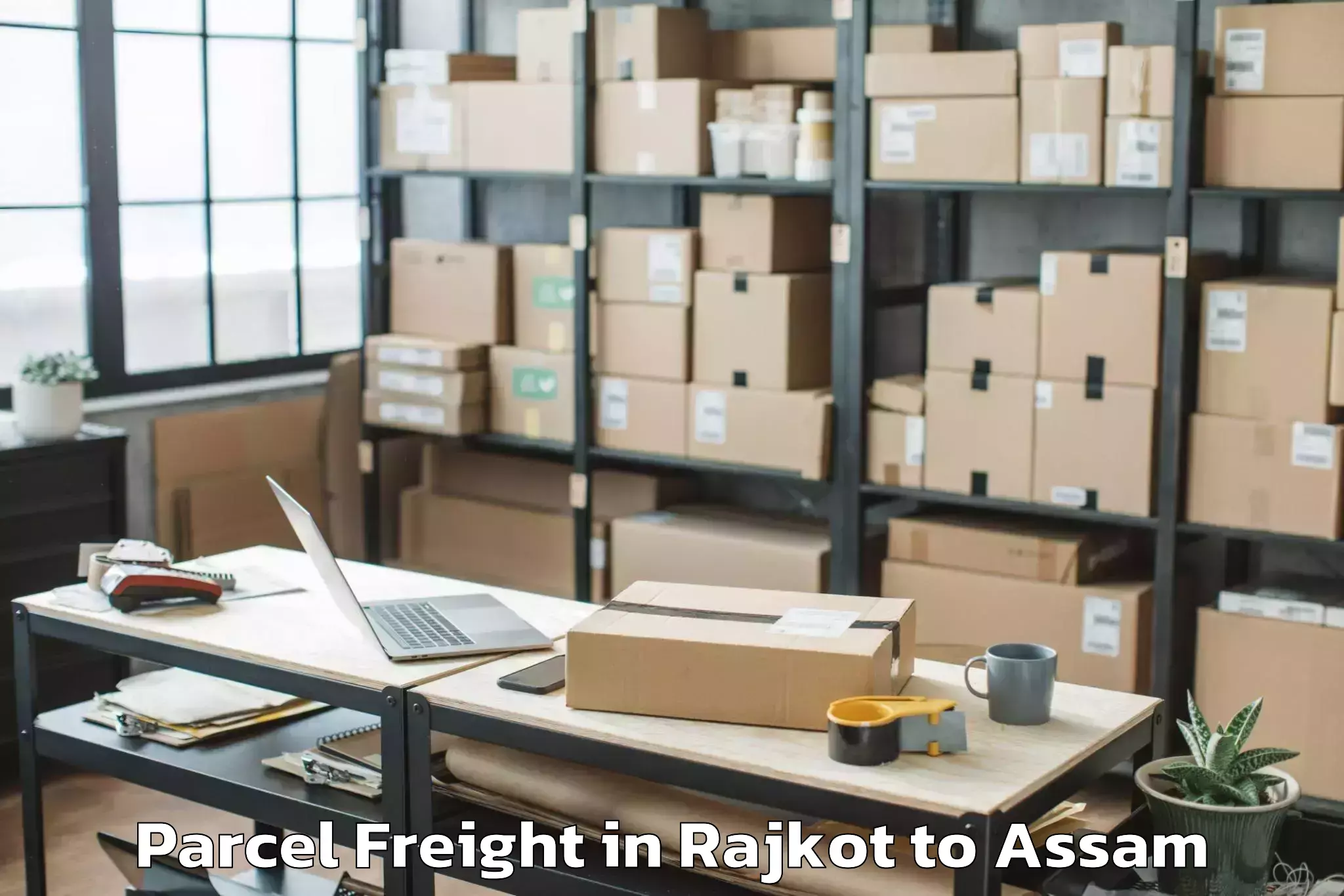 Hassle-Free Rajkot to Kharupetia Parcel Freight